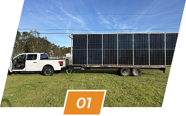 White pickup truck towing a Winged Solar panel trailer — transport step